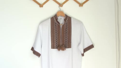 Ukrainian Clothes Embroidered Shirt Brown Threads Background Vyshyvanka is a Symbol of Ukraine