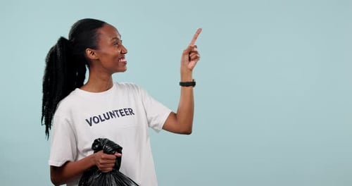 Trash bag, volunteer and happy black woman point at garbage pollution news