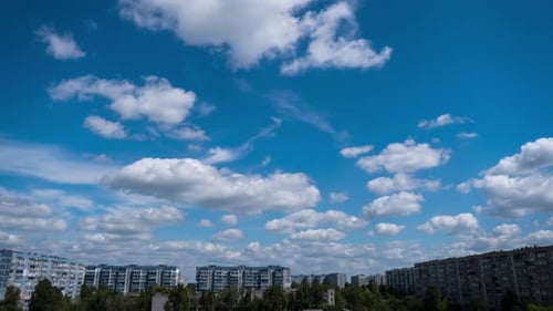 Timelapse of Clouds in the Blue Sky Moves Over the City