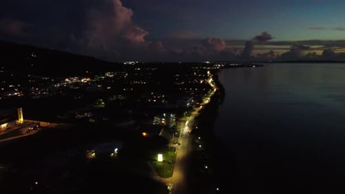 Aerial view of road along coastline at dusk
