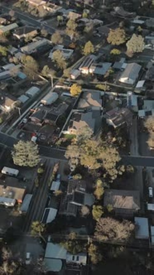 Vertical drone tilt up revealing entire suburb houses Canberra residential neighbourhood
