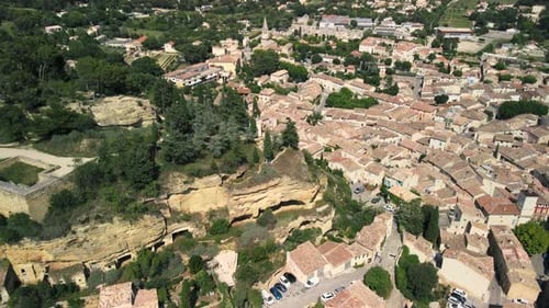 Wide aerial view of neighborhood in Cadenet in Provence, France on a partly cloudy summer day