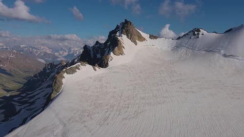Majestic Winter Landscape Aerial View to Mountain Slopes Snowy Beauty Cloudy Skies Mountain Slopes