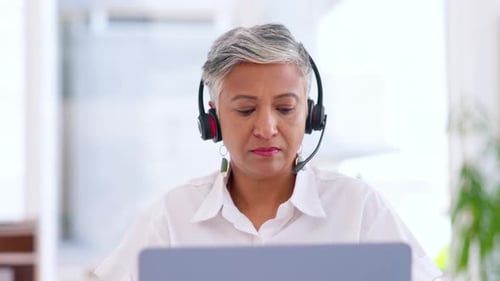 Mature business woman, laptop and call center in CRM office, customer support company