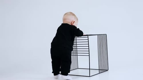 Cute Baby Learning to Stand with Assistance