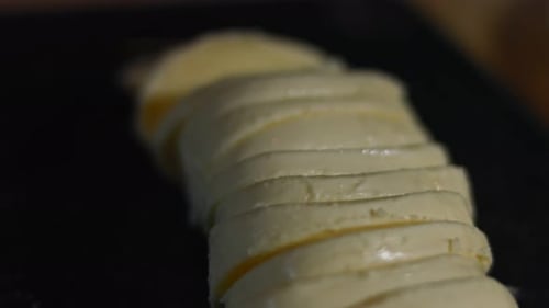 Sliced Mozzarella on a Cutting Board