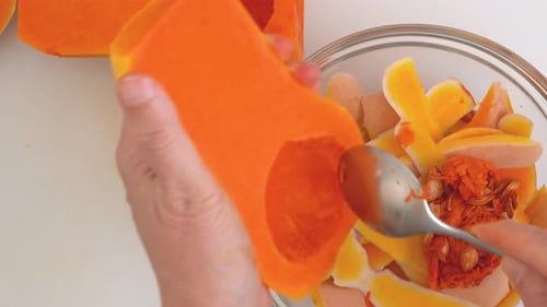 Butternut Squash Soup Recipe Preparation processWoman Hands Peeling Squash Flat Lay