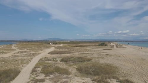 4k taking off clip over a peninsula on the tropical beach of Epanomi, Halkidiki, Greece