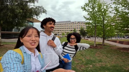 Diverse Students Posing on College Campus Lawn