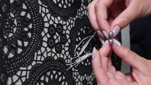 Elegant Earrings Placed on Delicate Black Lace