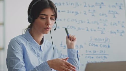 Woman Teaching Math Online from Home with Laptop