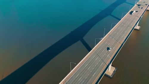 Automobile bridge with one-way multi-lane road. Transport moving by the bridge