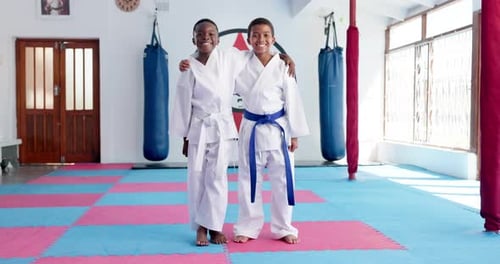 Smiling Boys in Karate Uniforms Posing Together
