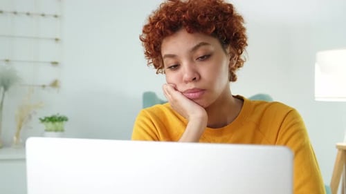 Sleepy Sad African American Woman Sitting at Table with Laptop Tired Overworked Girl Lazy to Work