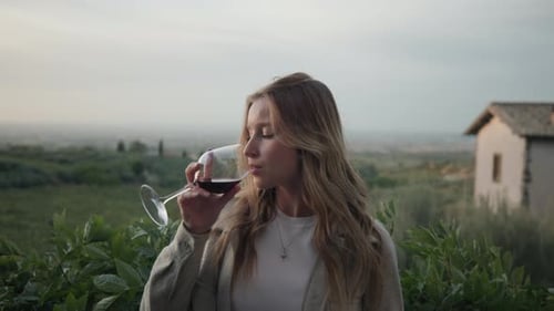 Beautiful Blond Woman Drinking Red Wine With Nature Background. Close Up
