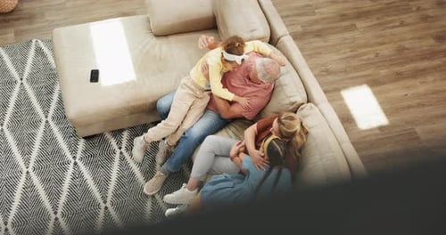 Family Embracing Together on Couch, Overhead Angle