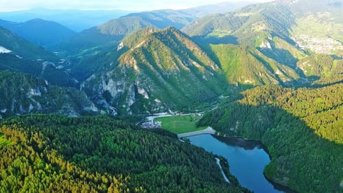 View From Rock to Town of Smolyan with Meadows for Cattle Walking and Houses Between Mountain Range