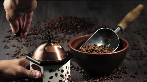 Grinding fresh roasted coffee beans using a vintage hand mill