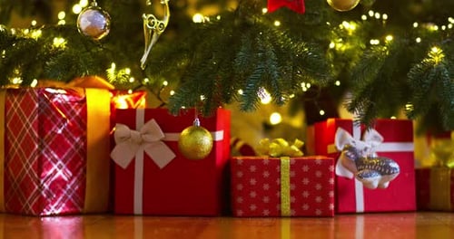 Christmas Gifts Under a Glowing Decorated Tree