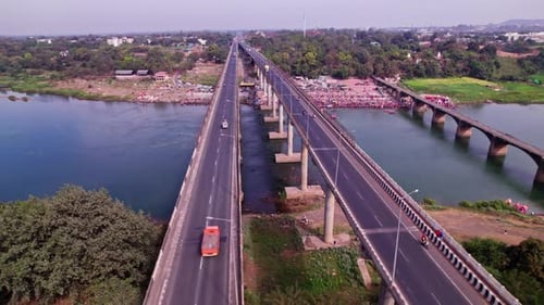 Narmada Bridge with Narmada river and vehicles at jotpur, jabalpur, madhya pradesh, india. day time,