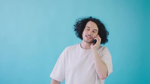 Young Adult Talking on a Mobile Phone