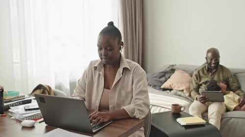 Black Woman Working on Laptop from Home