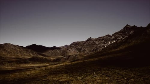 Majestic Mountain Landscape Under Clear Skies During Twilight in Rural Area