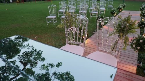 Elegant Wedding Reception Setup on Green Grassy Lawn