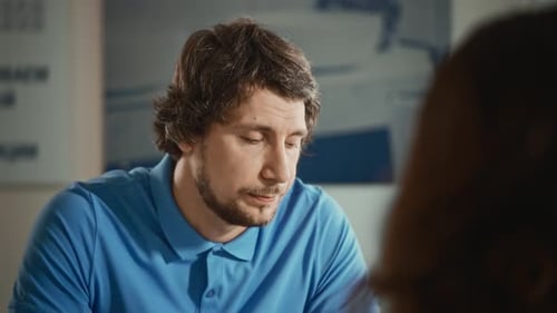 Charismatic Man Talking to a Female Colleague in the Office Work Matters are Discussed During