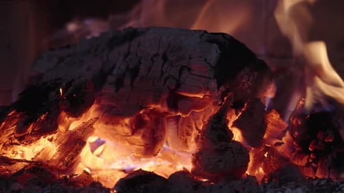 Burning Fireplace Logs and Embers for Cozy Ambience