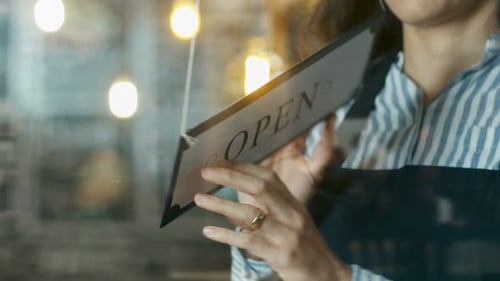 Cafe Owner Turning Storefront Sign From Close to Open and Welcoming Customers into Stylish Coffee S
