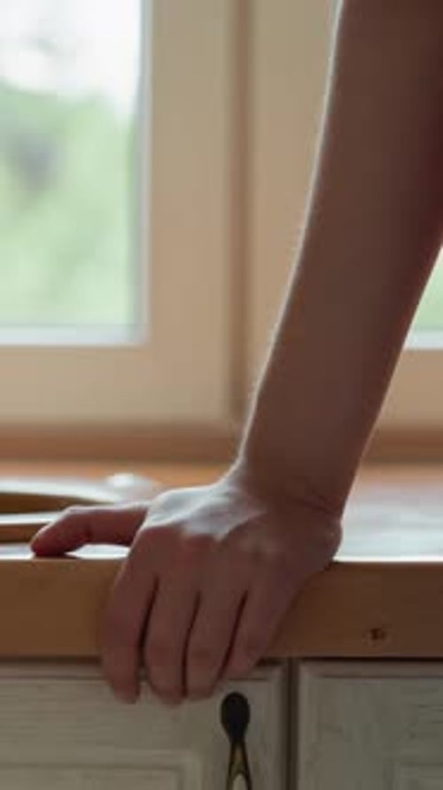 Woman Stands By Kitchen Sink with Vintage Tap