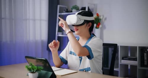 Woman Using VR Headset at Desk