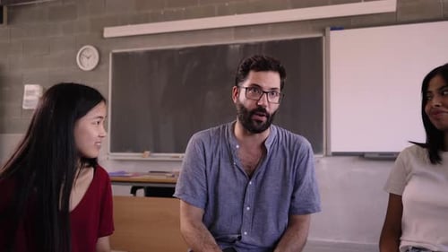 High School Teacher Discusses Concepts From Course Syllabus with Students Multiracial Young People