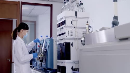 Scientist Working With Medical Equipment in a Lab