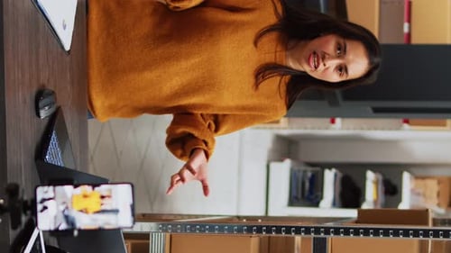 Woman Recording Business Promotional Video at Desk