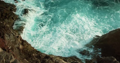 Rough Sea Waves Foaming on Rocky Shore Raging Ocean Turquoise Water