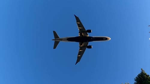 Jet airliner landing on runway.