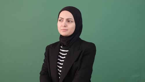 Woman Frowning and Crossing Arms in Studio
