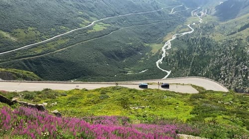 Serpentine road of Swiss alps Furka Pass with mountain panorama on summer day