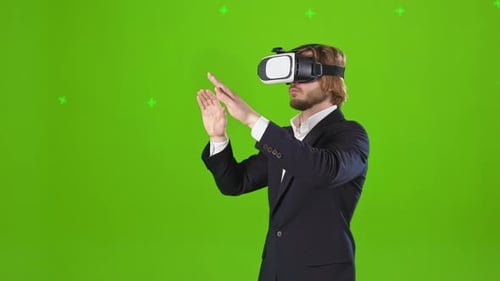 Young Handsome Man Watching Reality in Virtual Glasses