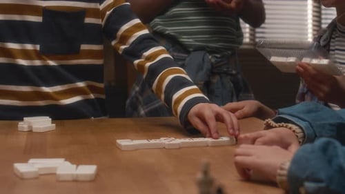 Diverse Friends Playing Dominoes