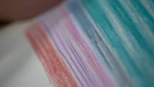 Child Coloring With Colored Pencils