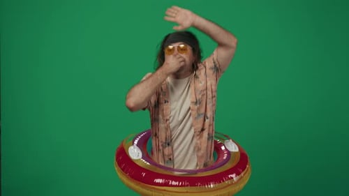 Man with Inflatable Tube Dancing on Green Screen