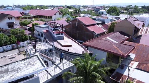 Aerial View of Tropical Neighborhood with Boat Building