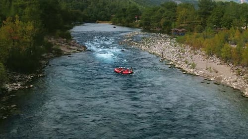 Active Tourists Spending Time for Rafting on Mountain River