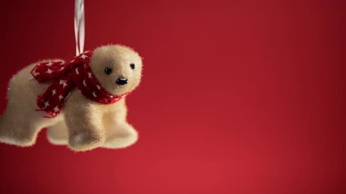 Bear Christmas Decoration on Red Background Copy Space