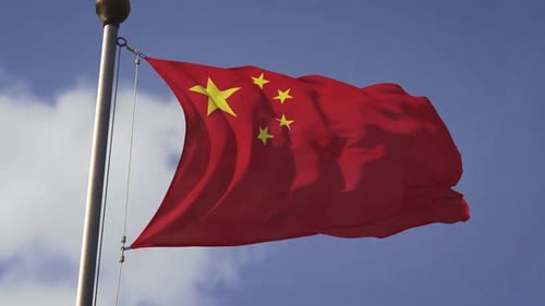 Realistic Chinese Flag Waving Against Blue Sky
