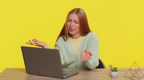 Frustrated Woman Closes Laptop Due to Headache