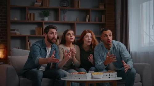 Friends Watching Television and Celebrating at Home